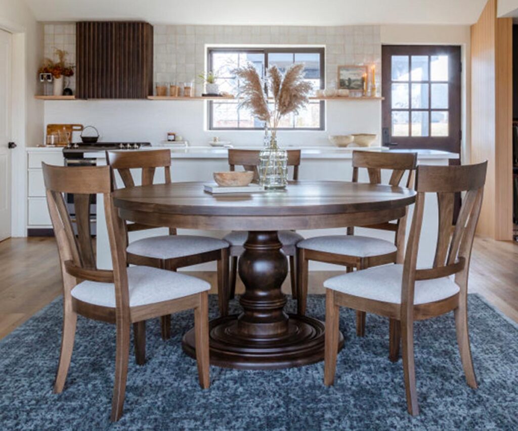 Elevating the Classics: A Popular Furniture Trend of 2025 3 Round dining set with wood tones reflecting the latest trends in kitchen design.
