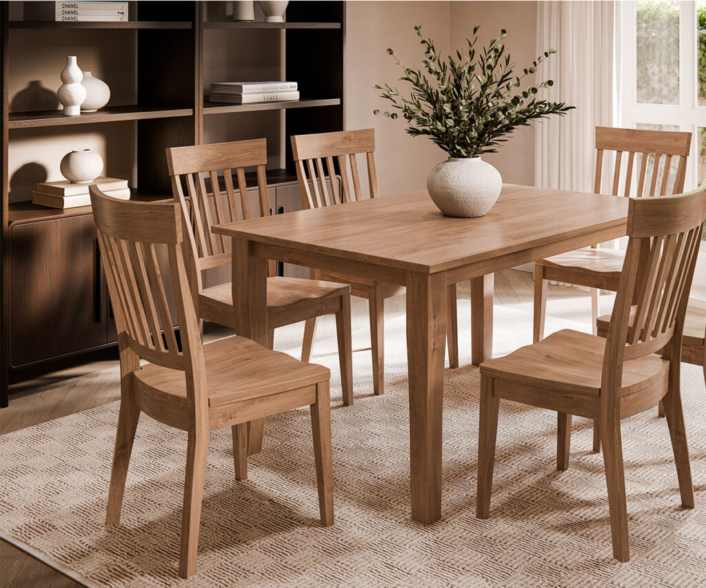 Choosing the Right Wood Species for Your Home 4 Maple dining table set with four chairs in a bright room beside built-in shelving.