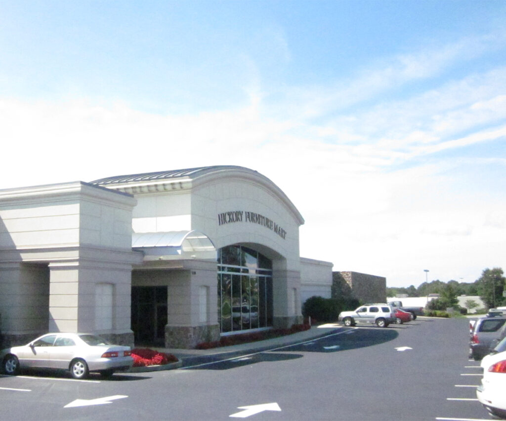Guide to Buying Furniture at Hickory Furniture Mart: Insider Tips 4 Hickory Furniture Mart exterior with on-site parking lot and directional arrows.