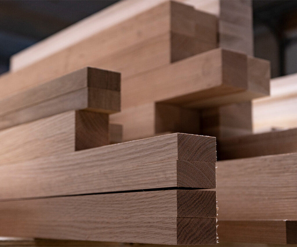 Why Americans Are Buying Amish-Made Furniture 8 Stacked solid hardwood pieces in a workshop ready for furniture construction