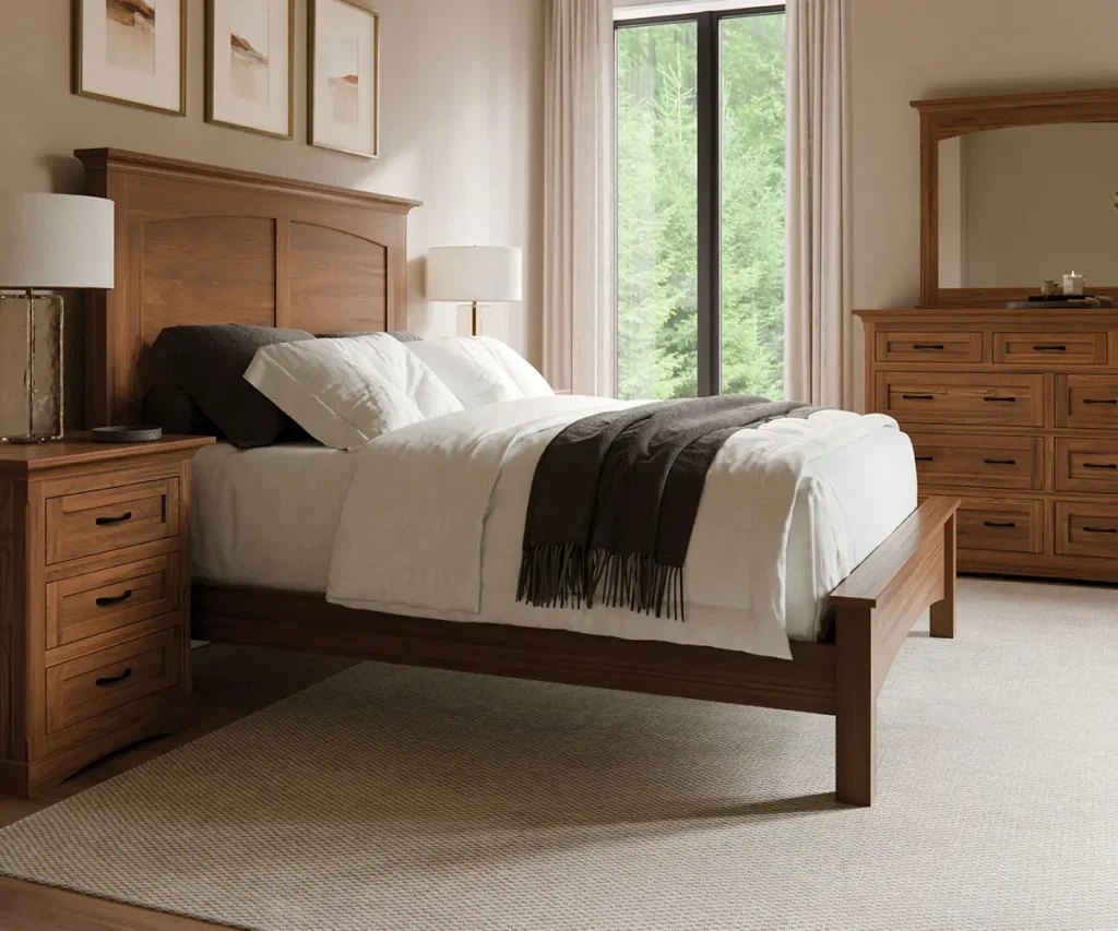 Warm wood bed with a coordinating nightstand and mirrored dresser.